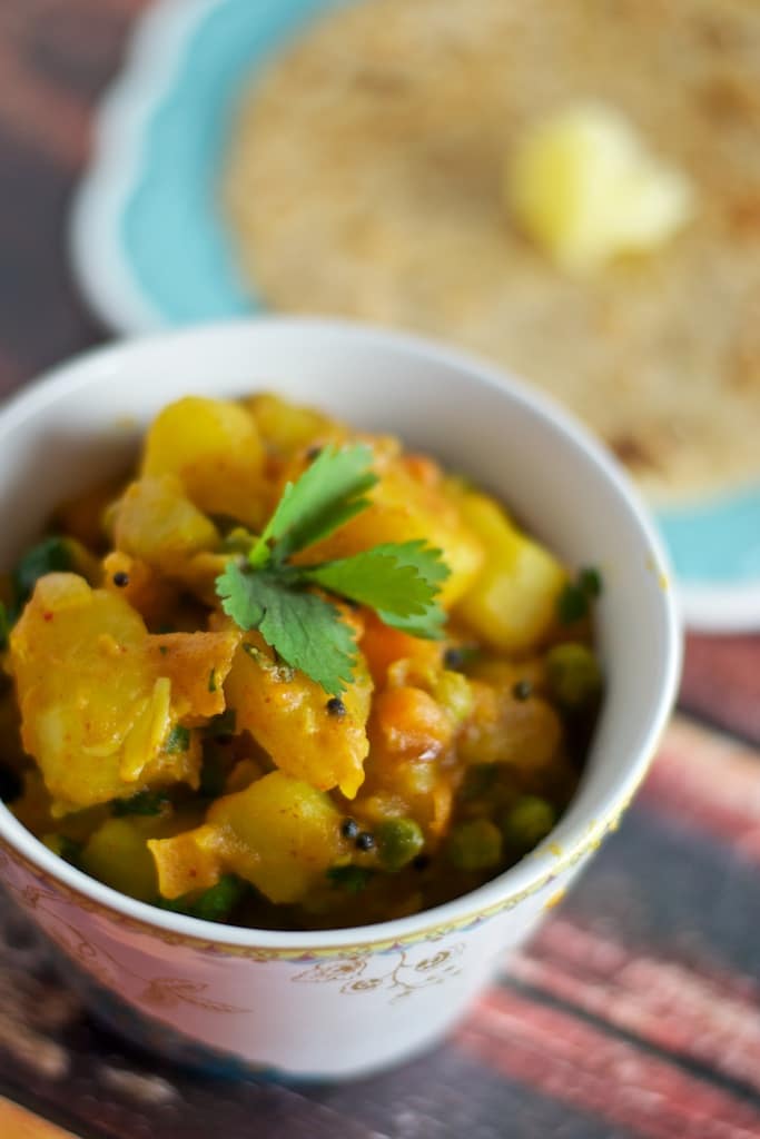 I love this recipe of Aloo Matar because it is easy to make, tasty and healthy - the perfect accompaniment to hot rotis!