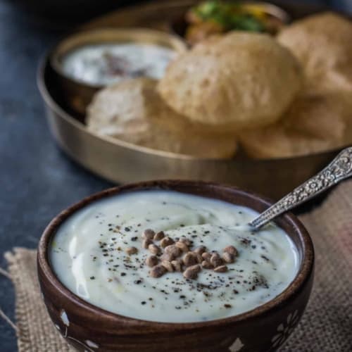 Shrikhand served in a wooden bowl