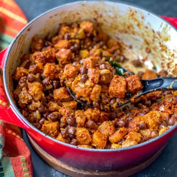 Chana Suran served in red Le creuset