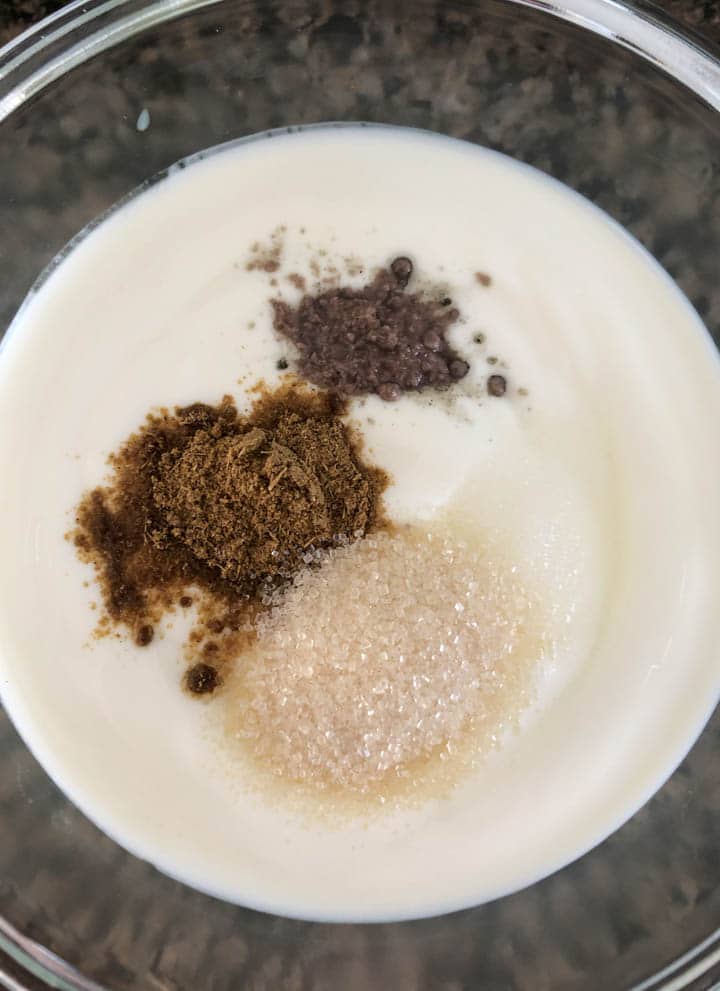 Salt, jeera powder, black salt and sugar are added to whisked yogurt