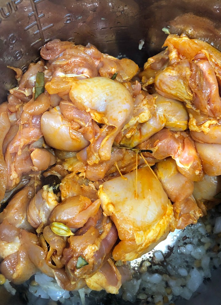Adding marinated chicken to onions