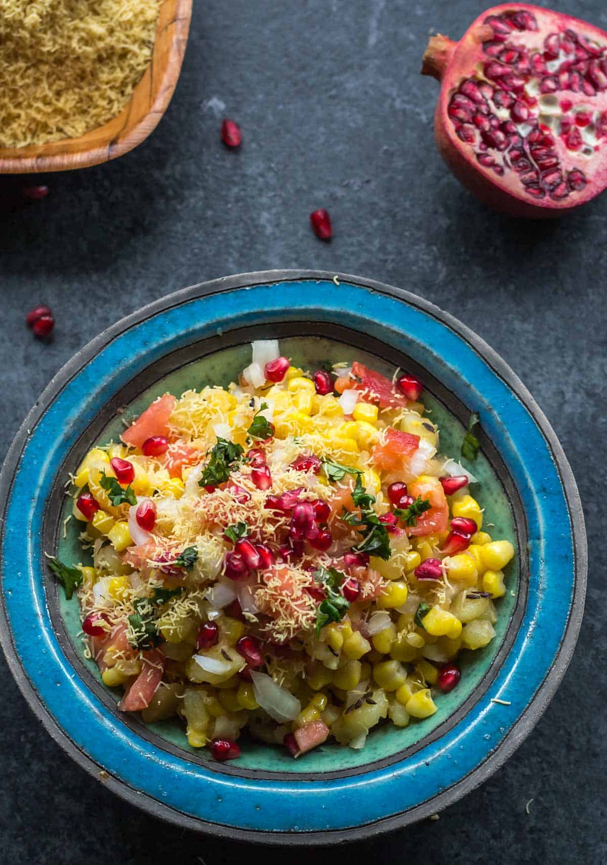 Try this non-traditional way of making corn bhel or corn chaat* and you'll be hooked. While most Indian street food demands a mandatory drizzling of tamarind chutney and green chutney, this no-fuss corn bhel recipe doesn't require either. Since corn bhel is best served at room temperature, it is perfect for not just as snacks but for school lunches too!