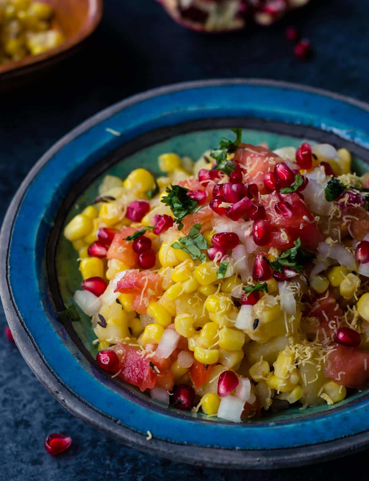 Try this non-traditional way of making corn bhel or corn chaat* and you'll be hooked. While most Indian street food demands a mandatory drizzling of tamarind chutney and green chutney, this no-fuss corn bhel recipe doesn't require either. Since corn bhel is best served at room temperature, it is perfect for not just as snacks but for school lunches too!