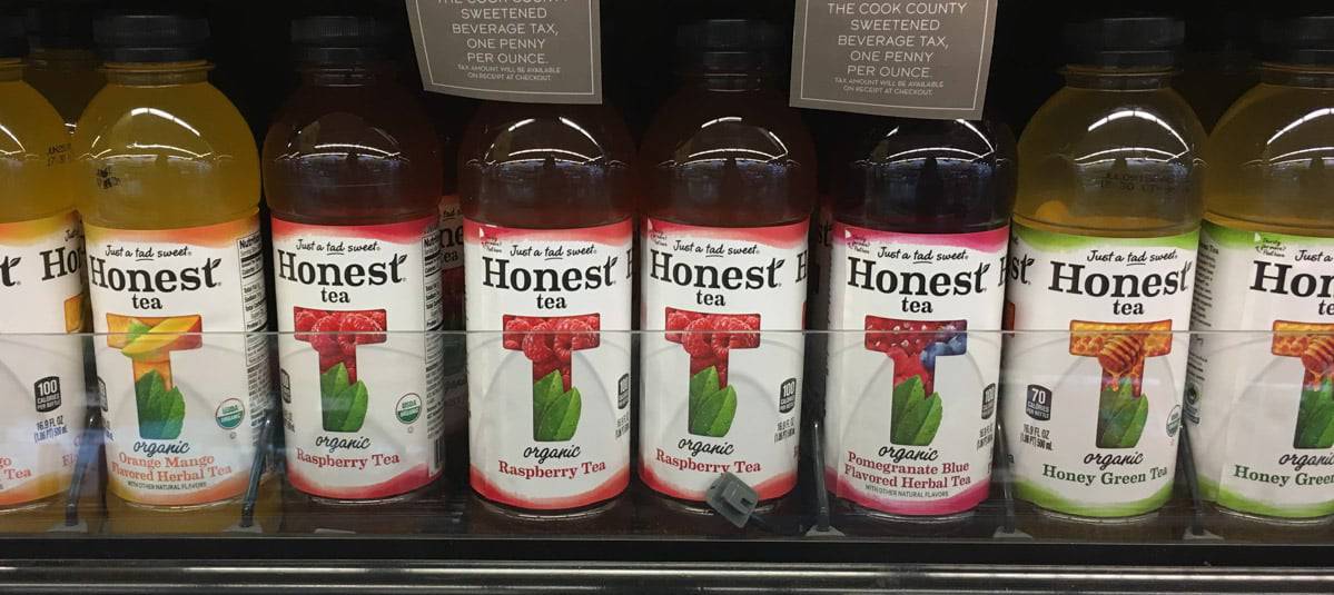 Different flavors of Honest Tea displayed in a grocery aisle