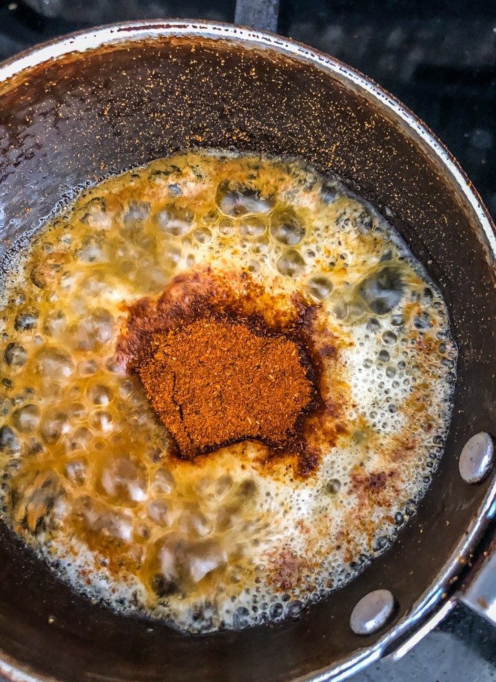 Asafoetida, Kashmiri chili powder, Pav bhaji masala, & butter in a tempering pan