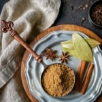 1/2 cup measuring cup filled with garam masala