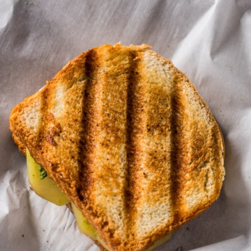 Grilled Bombay Sandwich placed on parchment paper