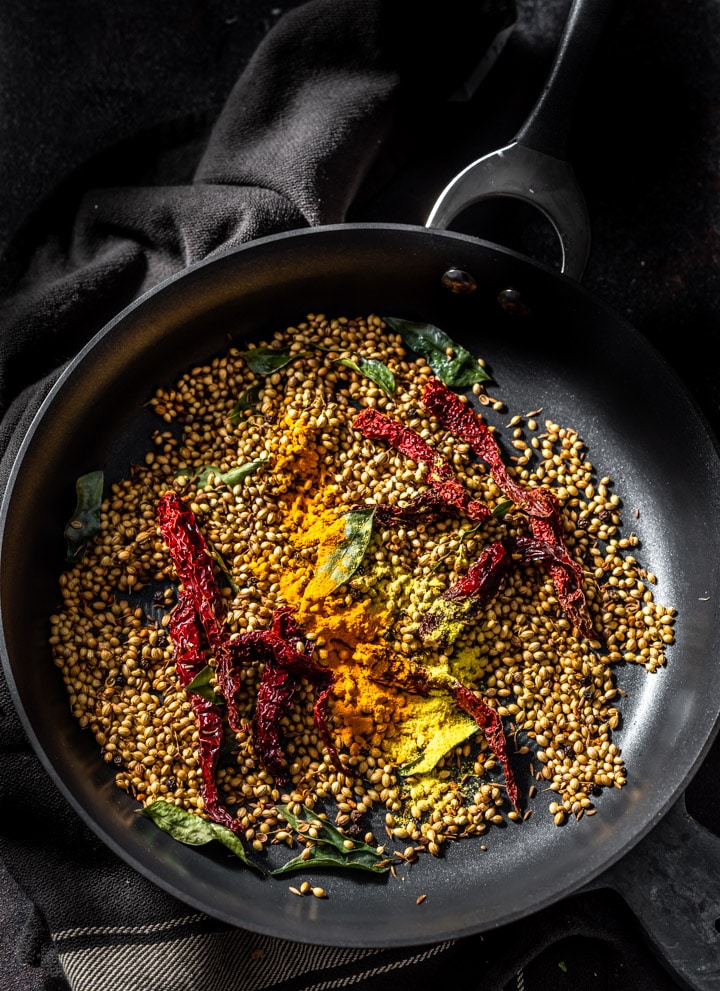 Roasted Rasam ingredients are placed in a pan