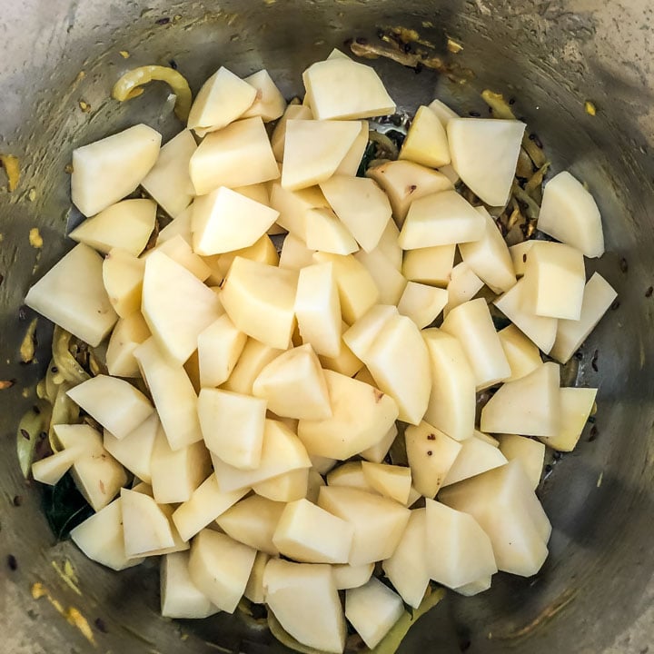 Add chopped potatoes to Instant Pot