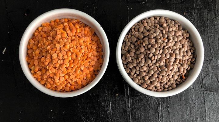 Masoor dal (split red lentils) and red lentils in a white bowl