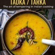 An image of dal tadka with tempering on it and with a caption Tadka / Tarka