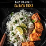 Salmon tikka served with rice and lemon wedges