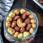 An overhead shot of nuts in a glass container