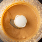 Creamy peanut butter in a food processor with the words.