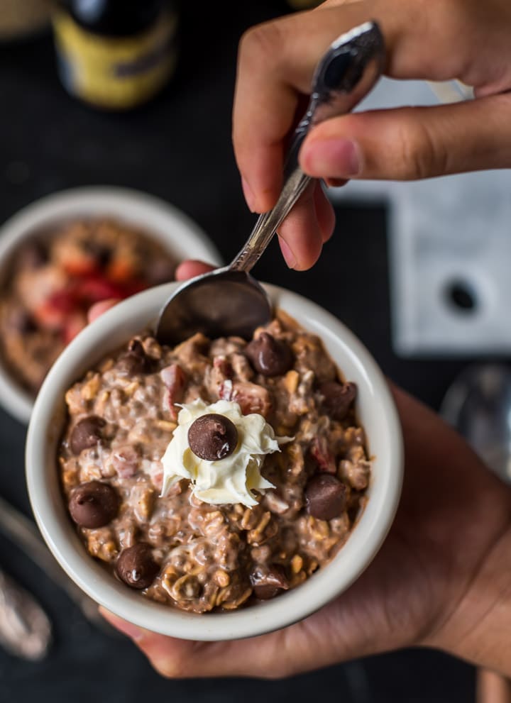 A spoon in inserted into a bowl of Tiramisu overnight oats