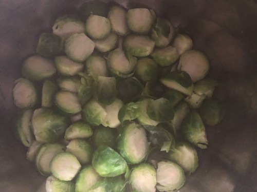 Brussel sprouts in the instant pot after steaming for 2 minutes.