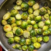 A pan of sautéed Brussel Sprouts with the words Instant Pot Steamed Brussel Sprouts at the top.