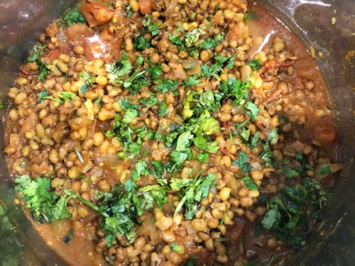 Cooked Mung Bean Curry in the instant pot topped with cilantro.