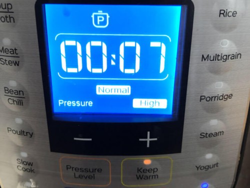 An instant pot pressure cooker showing the 7 minute cook time.
