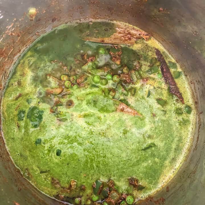 Spinach puree mixture coming to a boil.