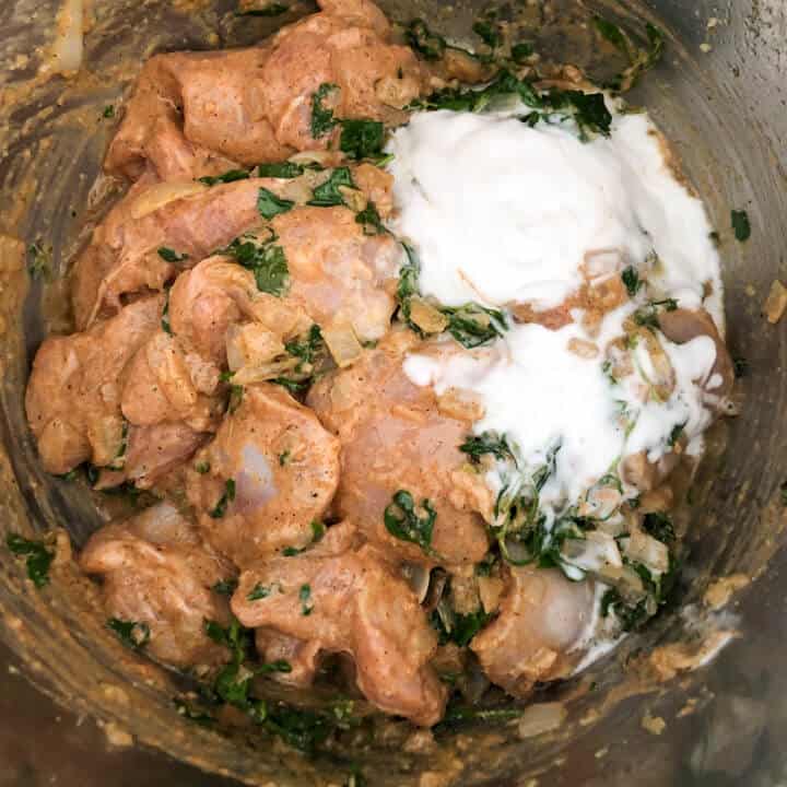Coconut milk added to chicken methi in the instant pot.