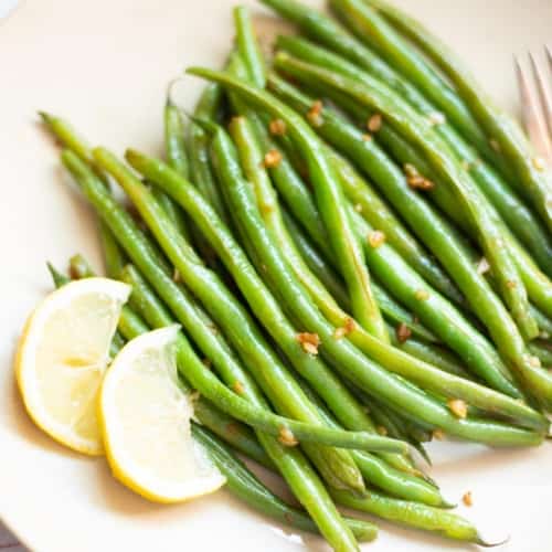 Green Beans served with a side of lemon
