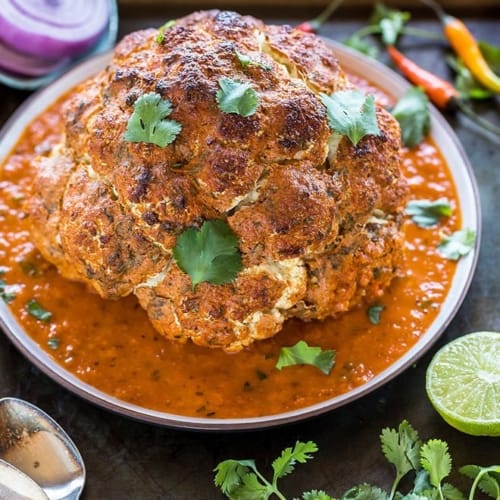 Whole Cauliflower cooked and served in a tomato sauce