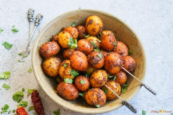 Bombay potatoes served in a brown bowl
