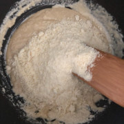 Milk and cashew powder mixture added to sugar syrup
