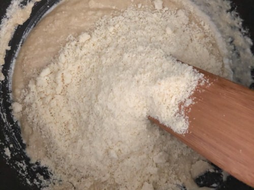Milk and cashew powder mixture added to sugar syrup