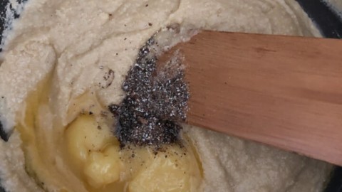 Ghee and cardamom powder added to cashew mixture