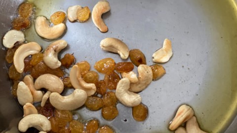 Raisins being fried along with cashews