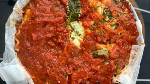A springform pan with instant pot lasagna after baking without foil.