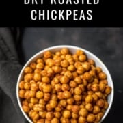 A white bowl with spicy roasted chickpeas on a black towel with the words How to Make Dry Roasted Chickpeas at the top.