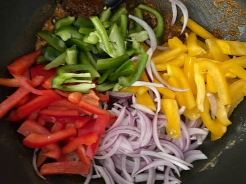 Wok with peppers and onions.