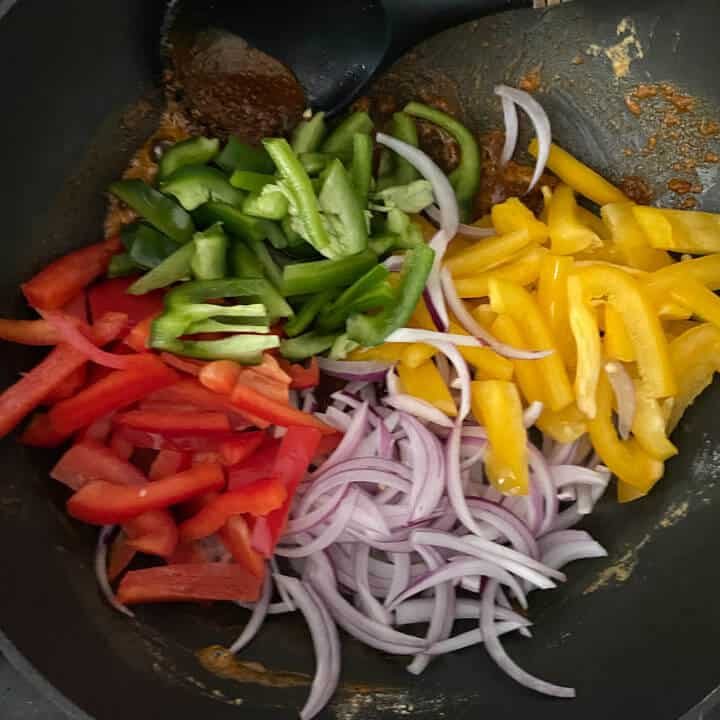 Wok with peppers and onions.