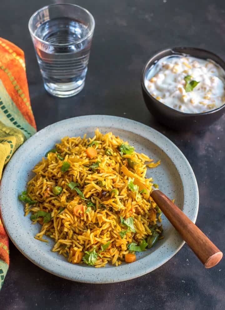a blue plate filled with this tawa pulao recipe