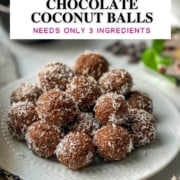 Chocolate coconut balls served in a white plate with chocolate chips in the background with text overlay
