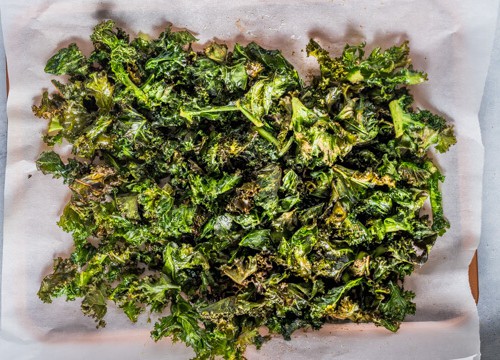 Air fried Kale chips on parchment paper
