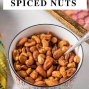Bowl of spiced nuts with a caption air fryer spiced nuts
