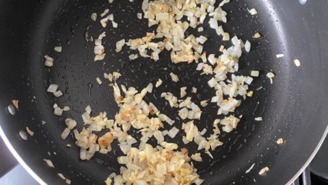 Browning onion in a skillet.