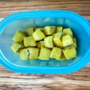 Frozen cubes of ginger paste added to a reusable plastic bag.