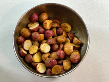 Potatoes stuff tossed with oil and seasonings.
