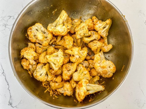 Cauliflower that has been tossed in oil and seasoning.