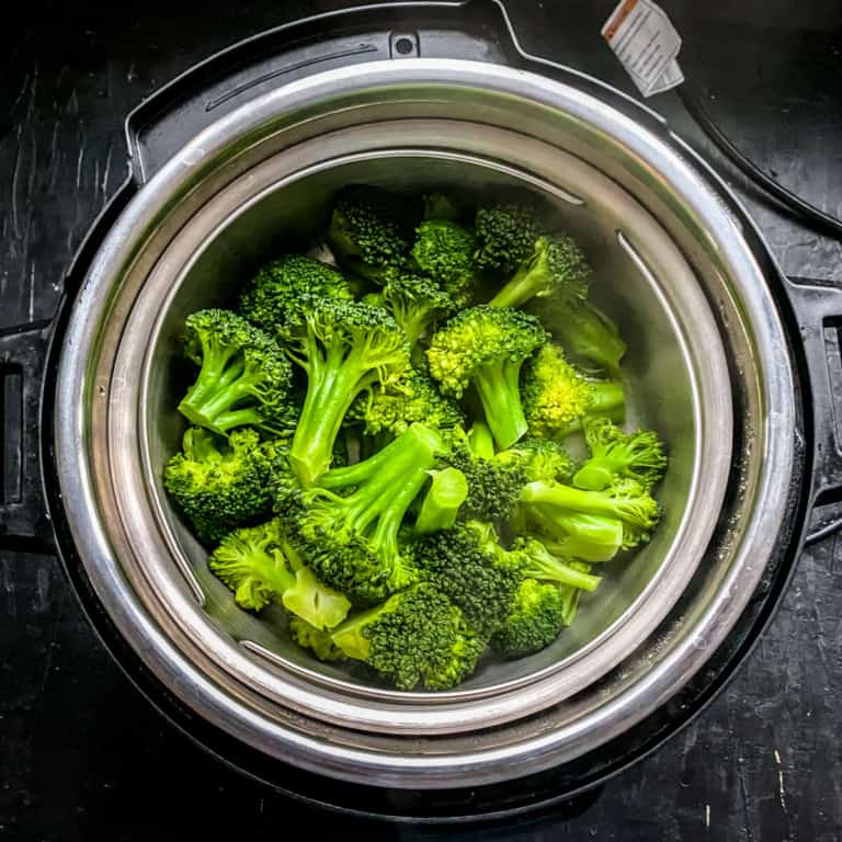 A top down photo of steamed broccoli in the instant pot.