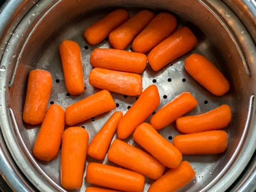Carrots in the steamer basket of the instant pot.