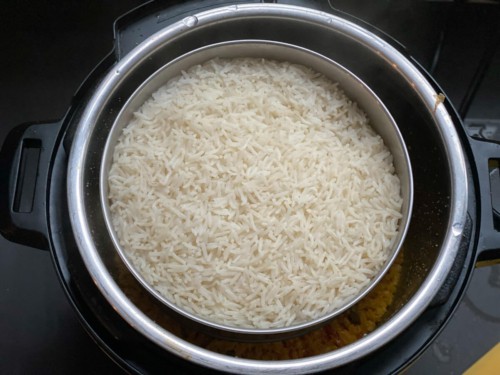 A bowl of cooked basmati rice inside of an Instant Pot.
