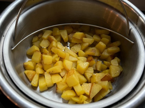 Potatoes in a steel bowl after cooking 4 minutes in the Instant Pot.