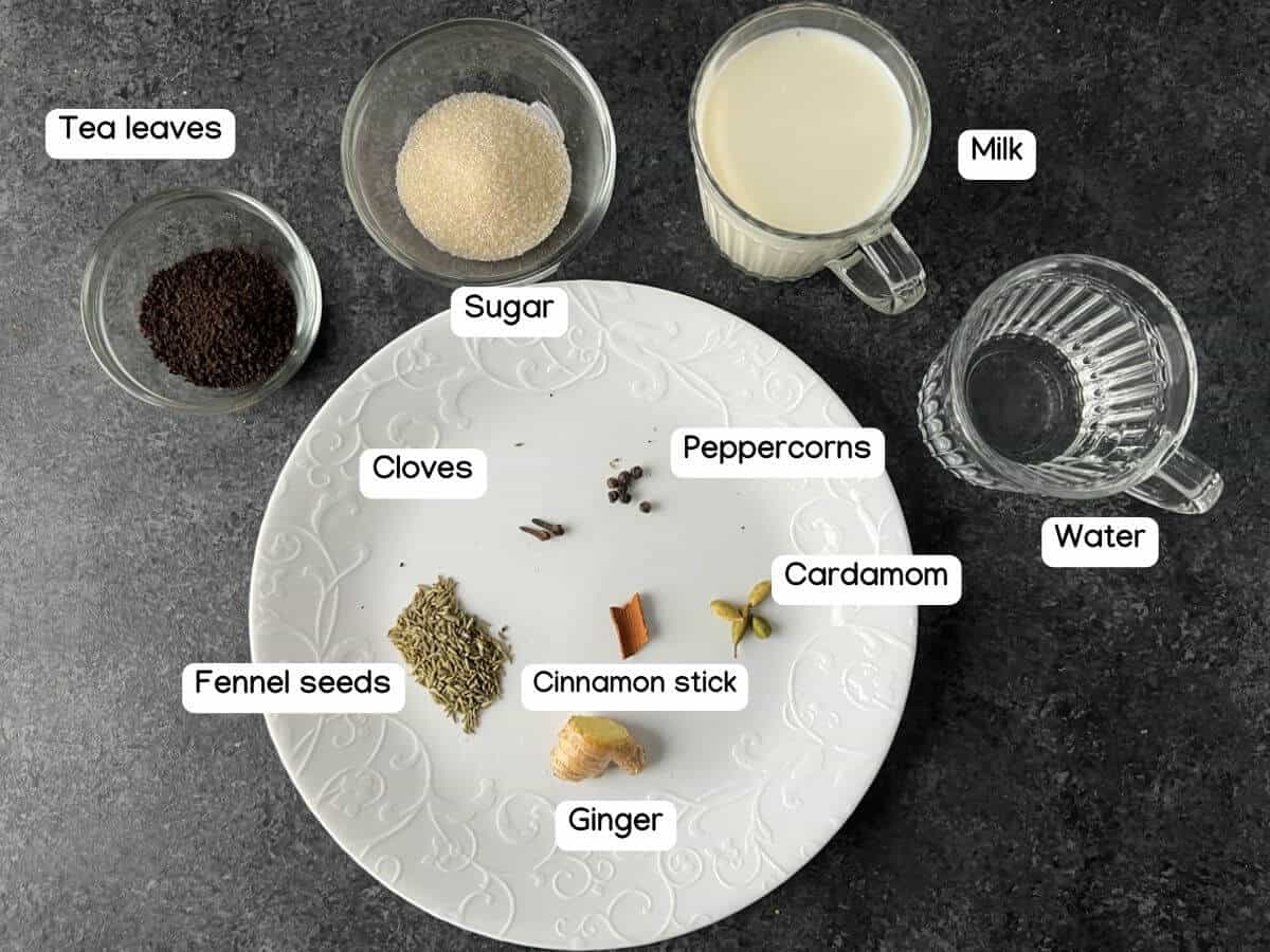 The ingredients and spices needed to make masala chai.