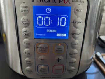 An Instant Pot with the timer set for 10 minutes.